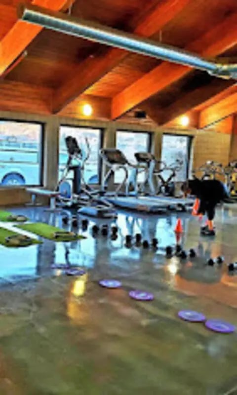 Gym equipment weights and mats fitness area at The House Apartments in Eagle Student Accommodation