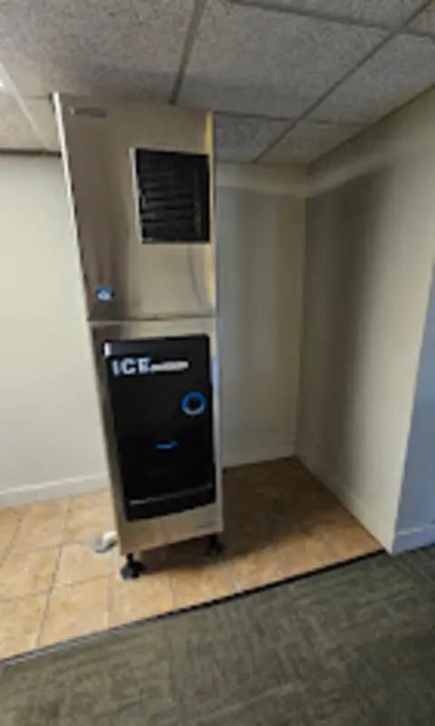 Commercial ice machine with black dispenser panel living area at The House Apartments in Eagle Student Accommodation