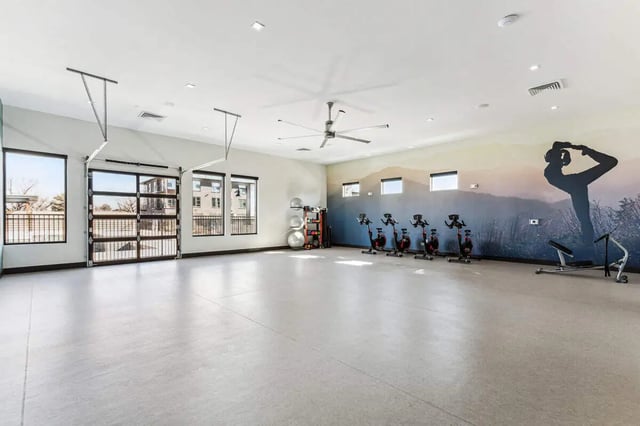 Spin bikes and weights in gym at Vida @ Fitzsimons in Aurora Student Accommodation