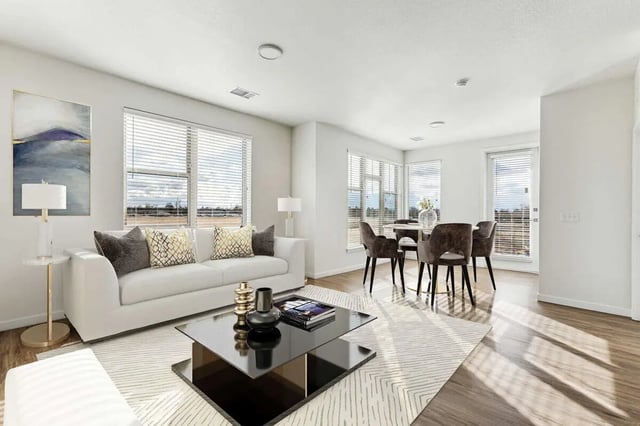 White sofa dining set coffee table living room at Vida @ Fitzsimons in Aurora Student Accommodation