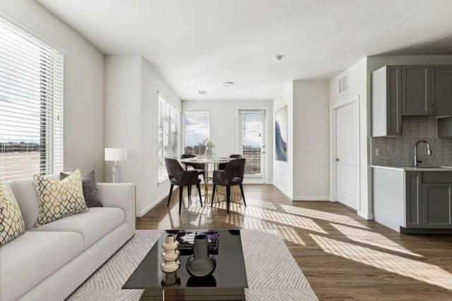 White couch coffee table dining set living room kitchen at Vida @ Fitzsimons in Aurora Student Accommodation