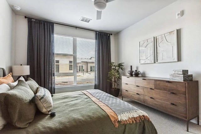 Bed dresser plant artwork bedroom at Vida @ Fitzsimons in Aurora Student Accommodation