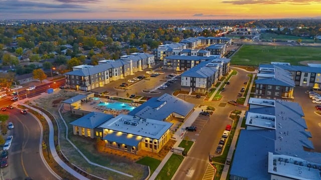 Apartment buildings pool and parking lot exterior at Vida @ Fitzsimons in Aurora Student Accommodation