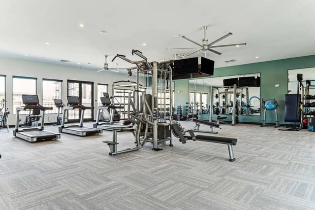 Gym with treadmills weight machines and free weights gym at Vida @ Fitzsimons in Aurora Student Accommodation