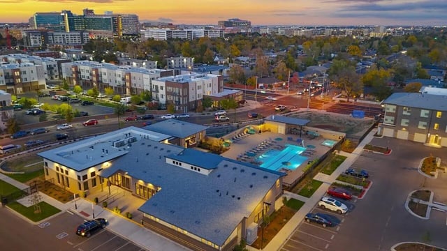 Apartment buildings pool and parking lot exterior at Vida @ Fitzsimons in Aurora Student Accommodation