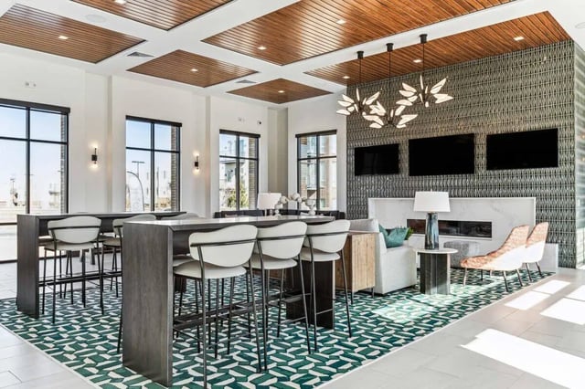 Bar and seating area with fireplace living room at Vida @ Fitzsimons in Aurora Student Accommodation