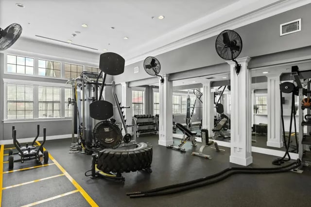Weight machines tire sled fans and mirrors gym at Campus Quarters at Corpus Christi in Corpus Christi Student Accommodation