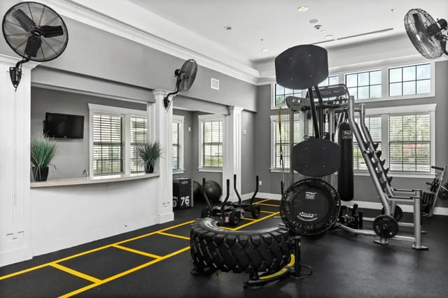 Fitness equipment with fans and TV gym area at Campus Quarters at Corpus Christi in Corpus Christi Student Accommodation