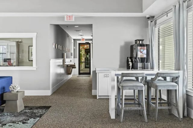 Coffee maker bar stools by window lounge area at Campus Quarters at Corpus Christi in Corpus Christi Student Accommodation