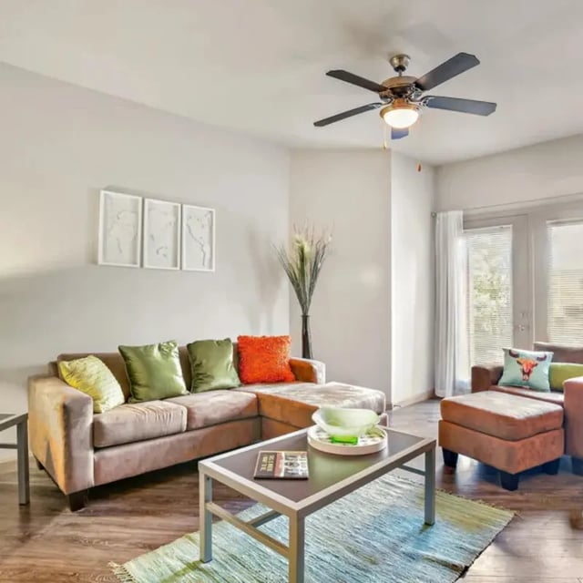 Sofa coffee table and ceiling fan living room at The Den in Columbia Student Accommodation