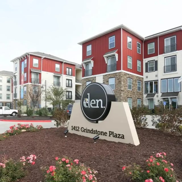 Den sign modern apartment buildings exterior at The Den in Columbia Student Accommodation