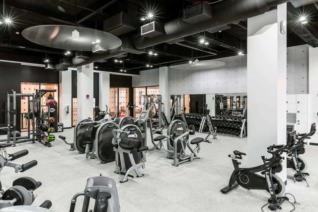 Gym equipment including weight machines and bikes gym at 20 Hawley Street in Binghamton Student Accommodation