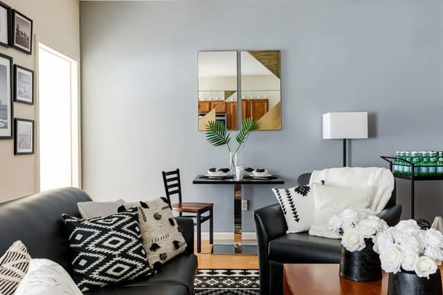 Sofa chairs table decor mirrors living room at 20 Hawley Street in Binghamton Student Accommodation
