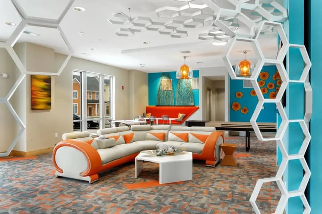 Modern sectional sofa white coffee table living room at The Dillon Bloomington in Bloomington Student Accommodation