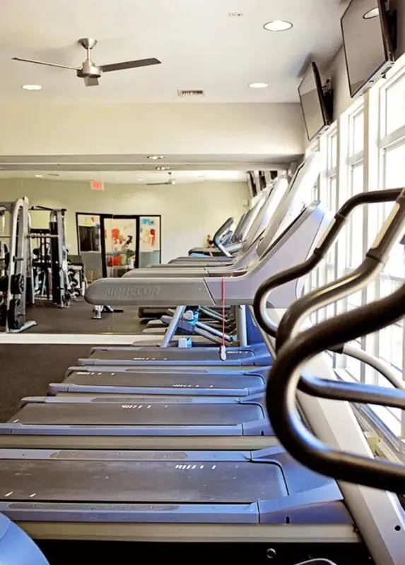 Treadmills exercise machines and ceiling fan fitness room at The Overlook at Nacogdoches in Nacogdoches Student Accommodation