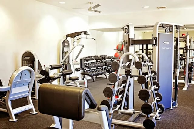 Gym equipment with weights and machines gymnasium at The Overlook at Nacogdoches in Nacogdoches Student Accommodation