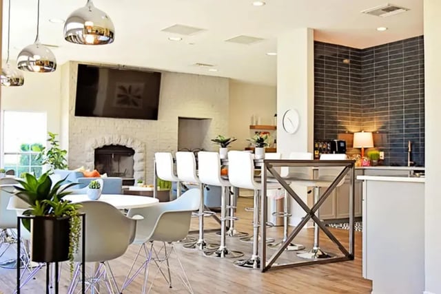 Modern living room with fireplace bar and kitchen at The Overlook at Nacogdoches in Nacogdoches Student Accommodation