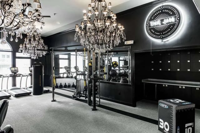 Chandeliers treadmills punching bag fitness center at University Village at Greensboro in Greensboro Student Accommodation