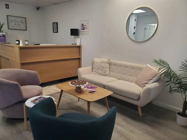 Sofa coffee table reception desk lounge area at Auden Ithaca in Ithaca Student Accommodation