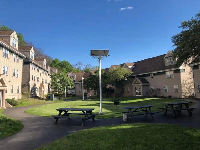 Buildings picnic tables and solar street light exterior at Auden Ithaca in Ithaca Student Accommodation