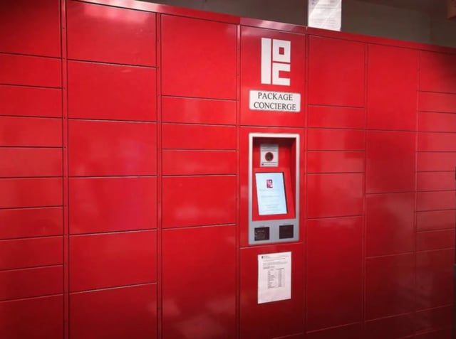 Red package lockers with touchscreen concierge kiosk Exterior at Auden Ithaca in Ithaca Student Accommodation