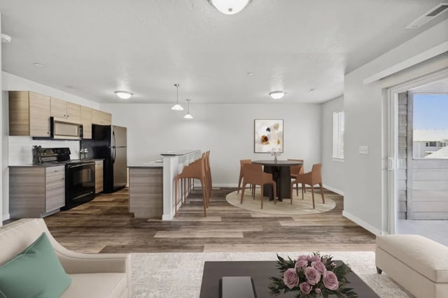 Kitchen dining and living areas with furniture Image at Ridgecrest Commons in Nampa Student Accommodation