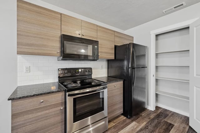 Modern kitchen with microwave oven and refrigerator kitchen at Ridgecrest Commons in Nampa Student Accommodation