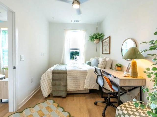 Bed desk chair lamp plants bedroom at Rambler Athens in Atlanta Student Accommodation