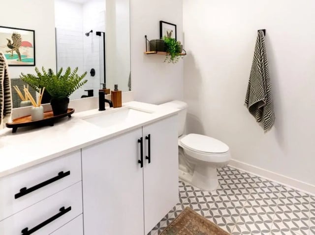 White vanity sink toilet patterned floor bathroom at Rambler Athens in Atlanta Student Accommodation