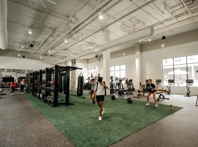 Gym equipment people weights and punching bag gym at Rambler Athens in Atlanta Student Accommodation