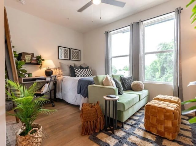 Bed desk couch pillows rug living room at Rambler Athens in Atlanta Student Accommodation