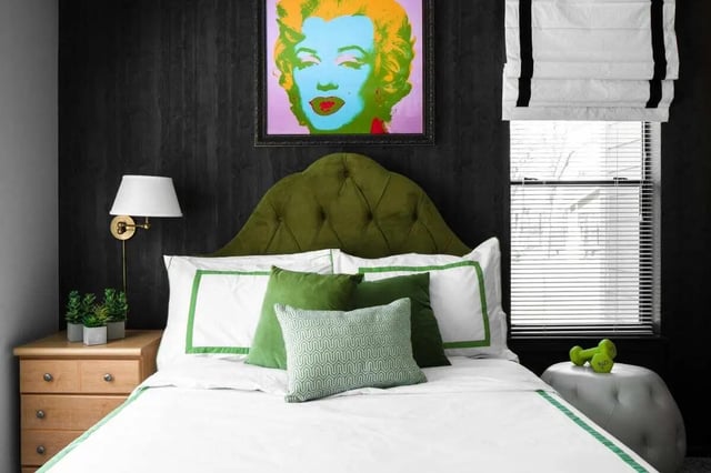 Marilyn Monroe art green headboard plush pillows bedroom at The London in College Station Student Accommodation
