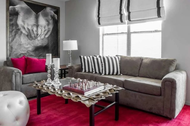 Sofa chess board ottoman painting living room at The London in College Station Student Accommodation