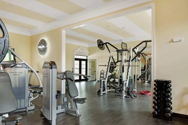Weight machines and dumbbells gym at The London in College Station Student Accommodation
