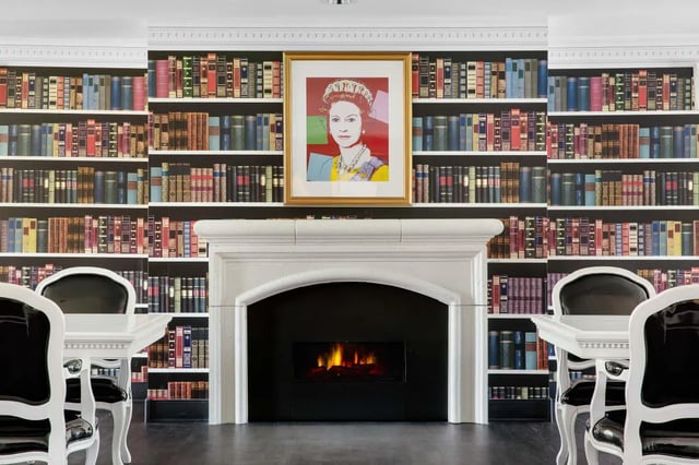 Fireplace portrait of Queen Elizabeth wallpaper living room at The London in College Station Student Accommodation