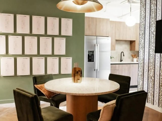 Round table with chairs and kitchen area dining room at Rambler Atlanta in Atlanta Student Accommodation