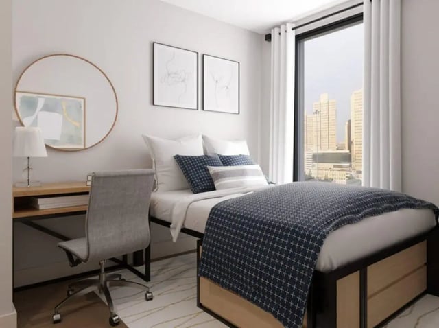 Bed desk chair mirror and framed art bedroom at Rambler Atlanta in Atlanta Student Accommodation
