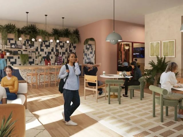 Students at cafe tables with plants and bar Interior at Rambler Atlanta in Atlanta Student Accommodation