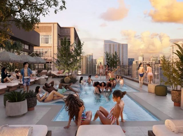 Rooftop pool with people lounging and swimming exterior at Rambler Atlanta in Atlanta Student Accommodation