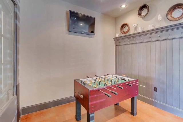 Foosball table mounted TV decorative mirrors recreation area at The Reserve in Carrollton Student Accommodation