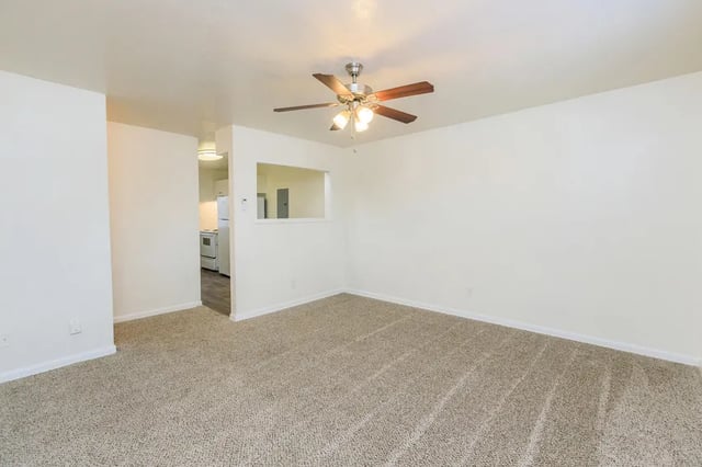 Carpeted living area with ceiling fan and pass through to kitchen at Belmont Crossing in Smyrna Student Accommodation