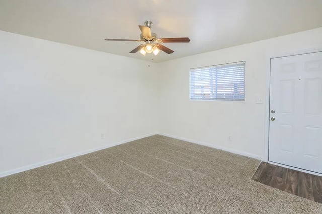 Ceiling fan window and white door living room at Belmont Crossing in Smyrna Student Accommodation