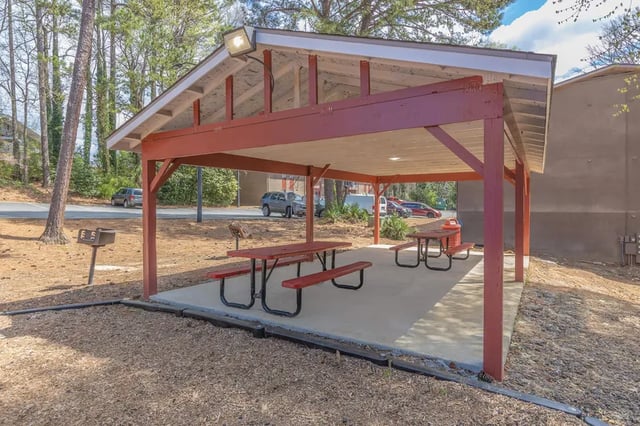 Picnic tables under covered pavilion exterior at Villas De Las Colinas 2 in Atlanta Student Accommodation