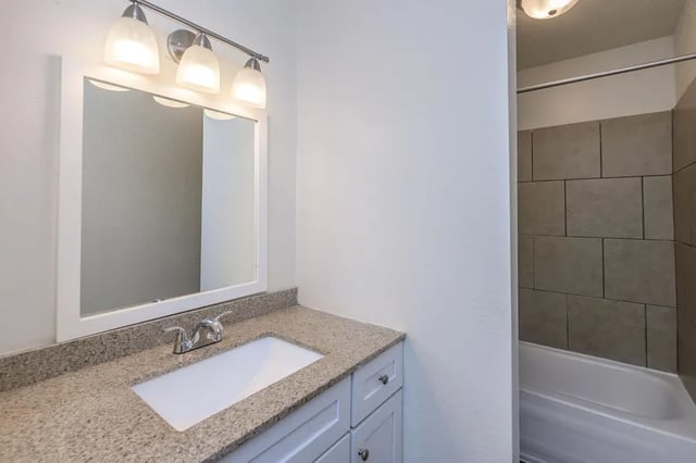 Mirror vanity with sink and tiled shower bathroom at Villas De Las Colinas 4 in Atlanta Student Accommodation
