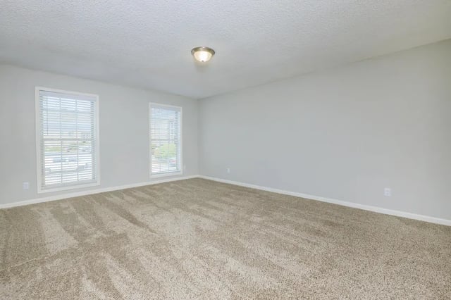 Empty room with carpet and windows Bedroom at Villas De Solana in Atlanta Student Accommodation