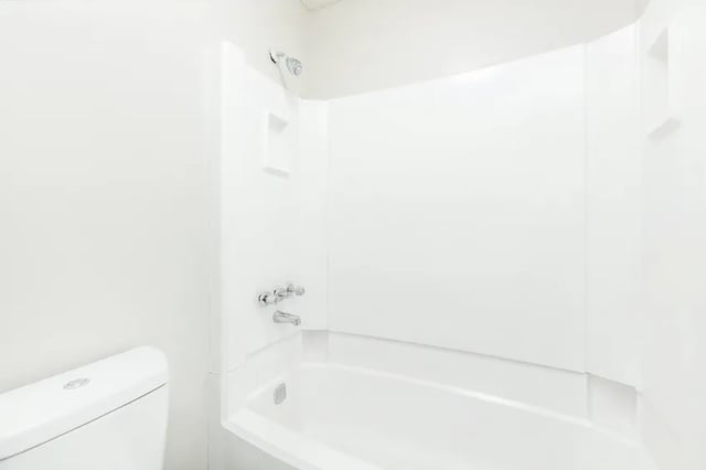 White toilet and bathtub with shower fixtures bathroom at Villas Del Mirasol in Roswell Student Accommodation