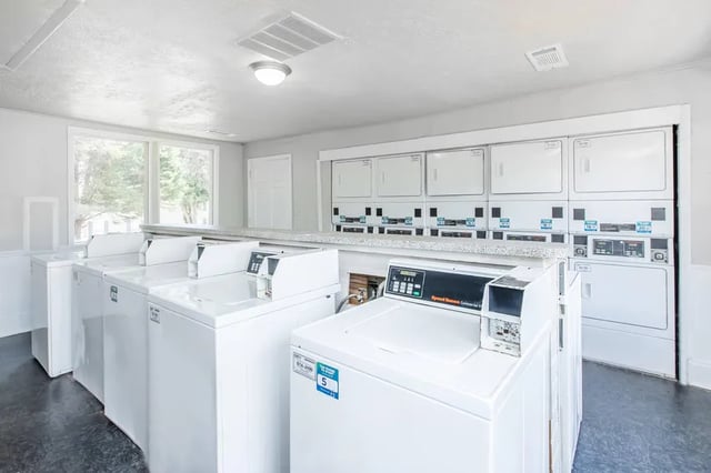 Washers dryers and windows laundry room at Villas Del Mirasol in Roswell Student Accommodation