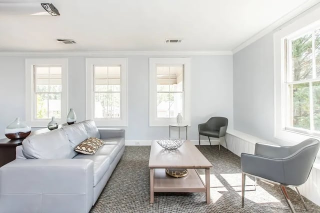 Gray sofa and chairs in living room living room at Villas Del Mirasol in Roswell Student Accommodation