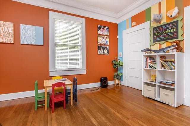 Kids table chairs shelf with books and toys play area at Villas Del Mirasol in Roswell Student Accommodation