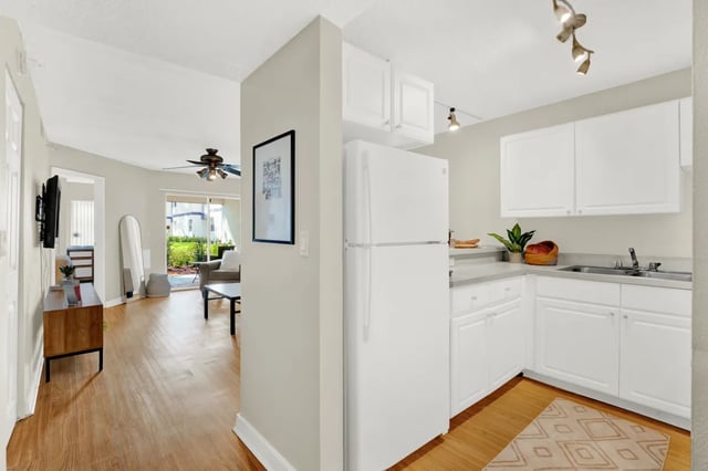 White refrigerator cabinets countertop sink kitchen at on50 Tampa Apartments in Tampa Student Accommodation